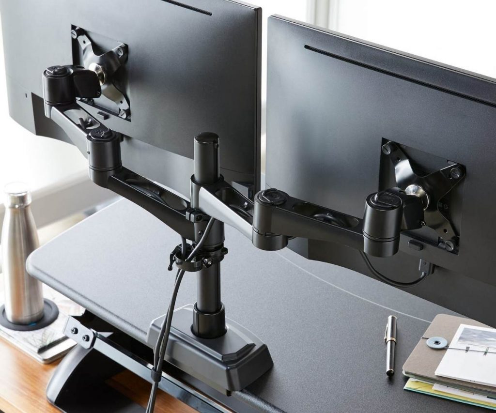 monitor arm attached to monitors and desk