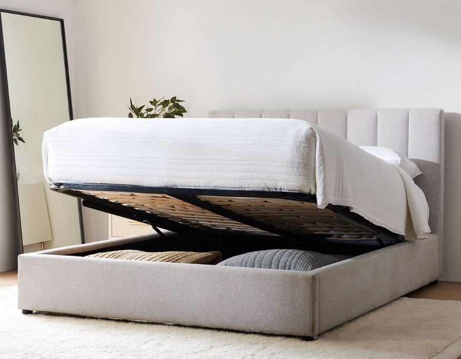 gray pop-up storage bed with tufting details and no-show legs